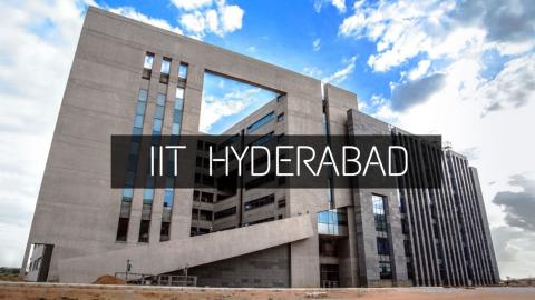 Front view of the IIT Hyderabad campus building showcasing modern architecture under a blue sky.