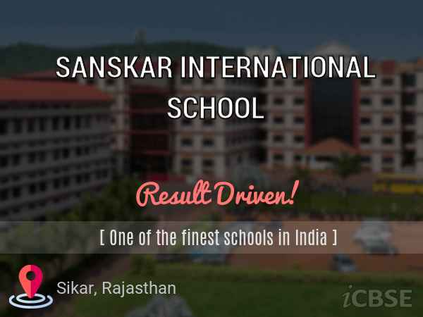 The Sanskarkar International School in Sikar, Rajasthan, is showcased in a captivating aerial and promotional view that highlights its expansive, multi-building campus set against a twilight or dusk sky with deep blue hues, emphasizing its status as a "Result Driven" institution and one of the finest schools in India. The complex features tall, modern multi-storey academic blocks in warm tones of beige, red, and orange with classic brick-like facades, numerous uniform windows arranged in neat grids, and several connected structures creating a grand, imposing yet welcoming educational hub. In the foreground, lush green lawns and open grassy areas stretch across the campus, dotted with scattered trees, pathways, and possibly playgrounds or sports fields, while distant views reveal surrounding rural landscapes, patches of greenery, and hints of urban development, all under a serene evening atmosphere. Overlaid text proudly declares "SANSKAR INTERNATIONAL SCHOOL" in large white letters at the top, with taglines "Result Driven!" in vibrant pink and "[One of the finest schools in India]" in elegant script, accompanied by a location pin icon marking Sikar, Rajasthan, and the iCBSE logo at the bottom, conveying a strong sense of academic excellence, discipline, holistic development, and a premium CBSE-affiliated environment that inspires ambition and success in a spacious, well-planned setting.